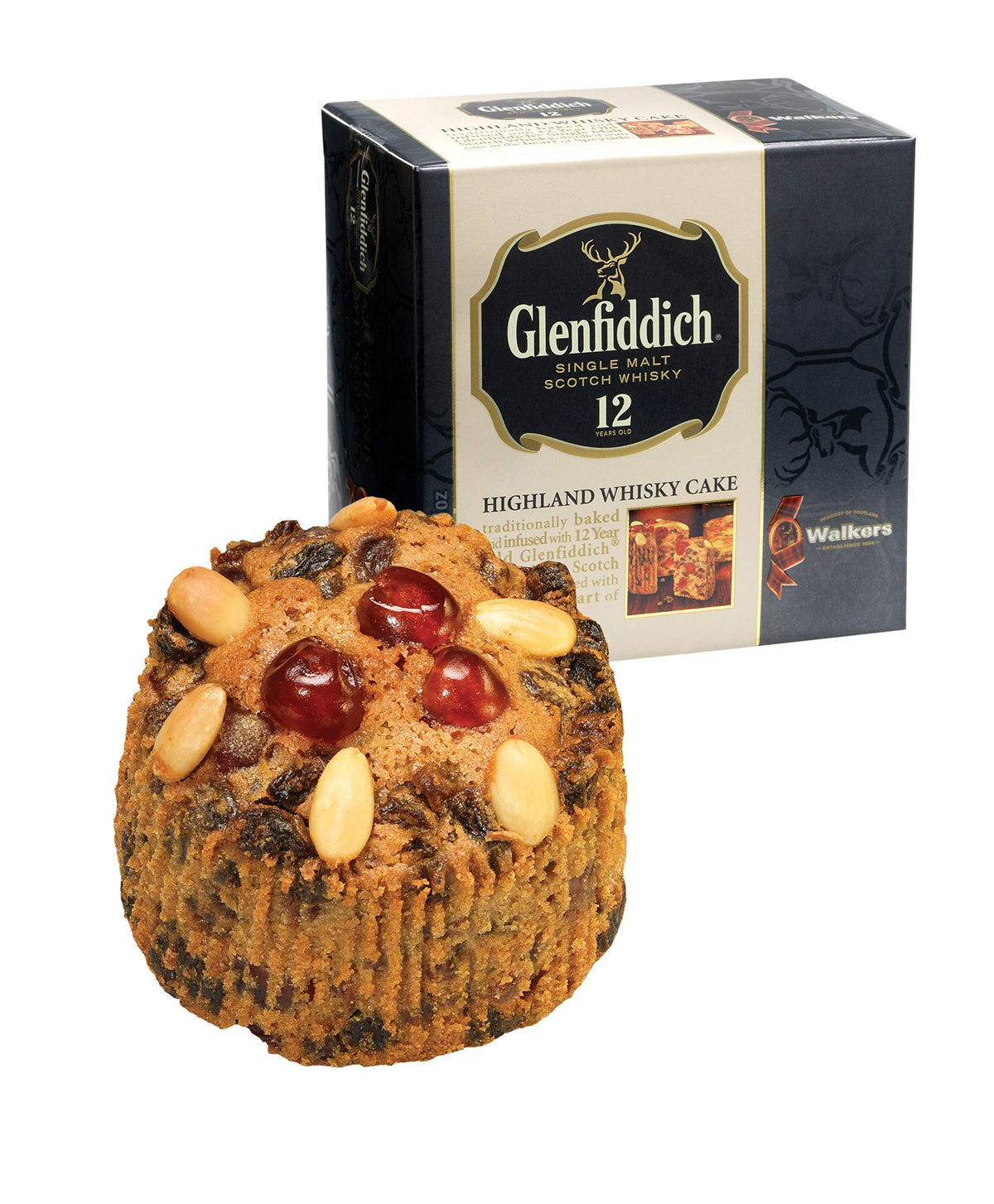 Glenfiddich malt whisky bottle beside cake suggests luxurious pairing.