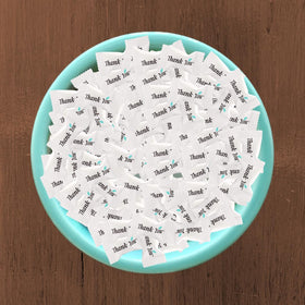 Global Basics mints arranged on event tables create a welcoming display.