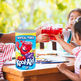 Global Basics Kool Aid Tropical Punch pouring hero glass highlights serving moment.