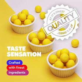 Global Gumball cake decorations with yellow gum balls for edible accents.