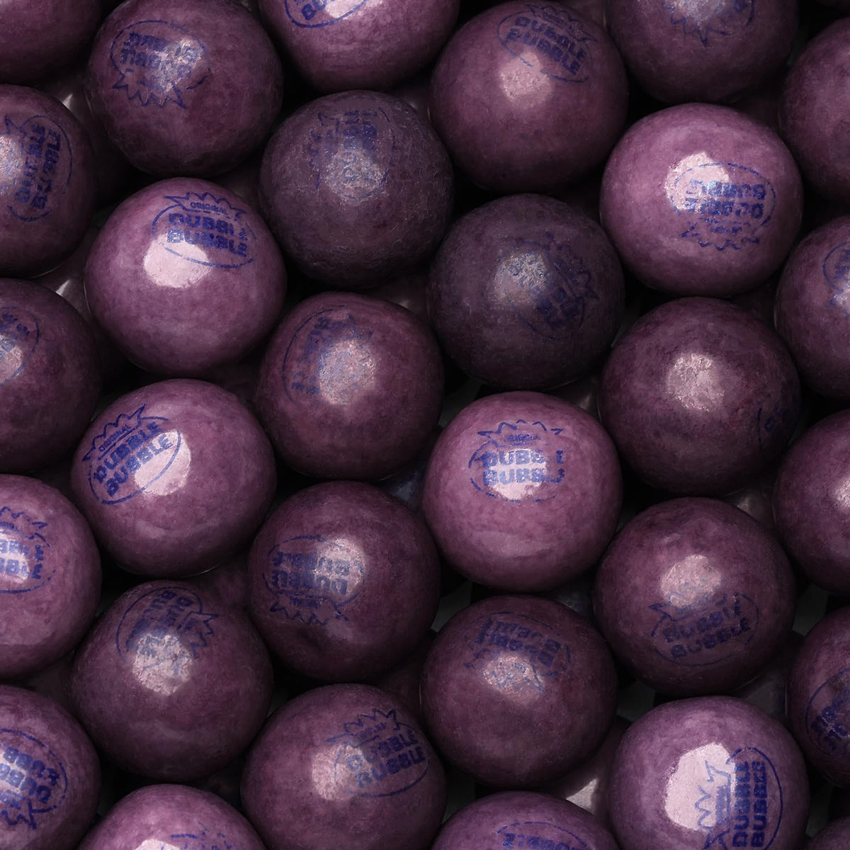 Global Gumball grape gumballs in a 1.7 lb bag for easy machine refills.
