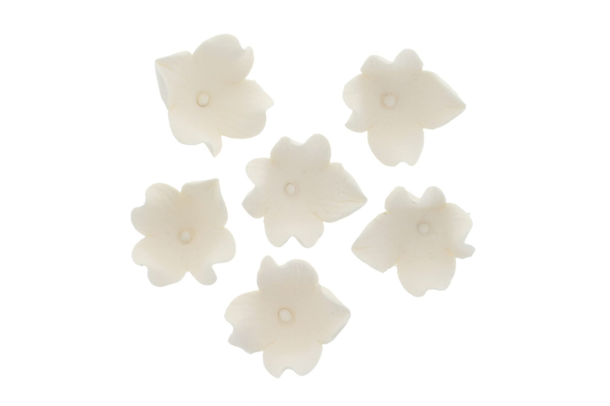 Global Sugar Art Hydrangea blossom sugar flowers as ornamental wedding accents.