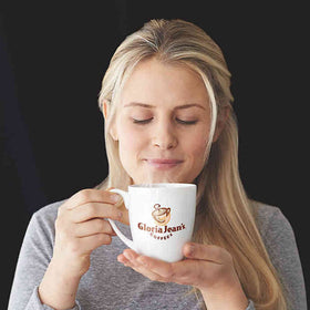 Gloria Jean's Macadamia Cookie K-Cup pods with mug suggest ready-to-sip moments.