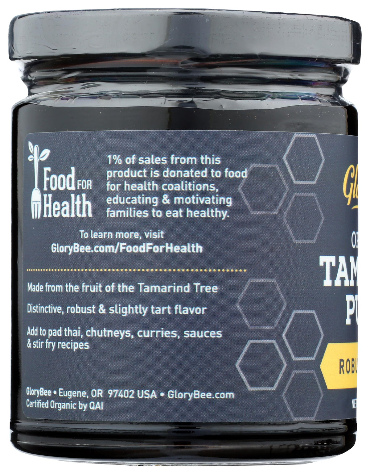 GloryBee organic tamarind paste pouring for curries and sauces.