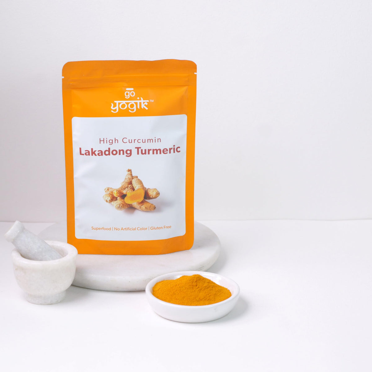 Go-Yogik Lakadong turmeric powder jar — rich color enhances curries and lentil dishes.