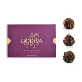 Godiva gift box packaging close-up showing purple and gold accents for premium presentation.