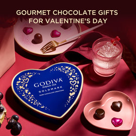 Elegant heart-shaped keepsake tin by Godiva, premium gift presentation.