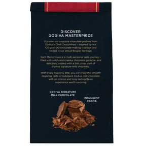 Close-up of a single Godiva Masterpiece Milk Chocolate Ganache piece revealing creamy center