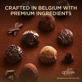 Godiva purple and gold gift box; elegant presentation for special occasions.