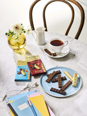 Godiva Gift Tin displays Signature Mini Bars for celebrations.