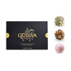 Close-up of glossy ganache centers inside Godiva truffles, luxury gifting.