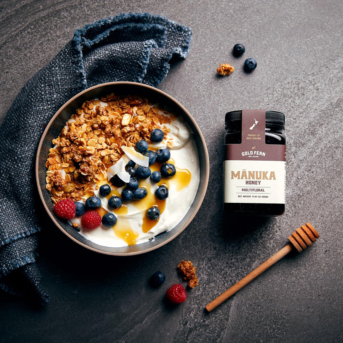 Gold Fern Honey Manuka honey closeup reveals rich color and natural crystals for tasting.