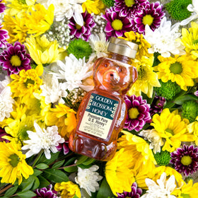 Golden Blossom honey spoon, amber color adds flavor to breakfast.