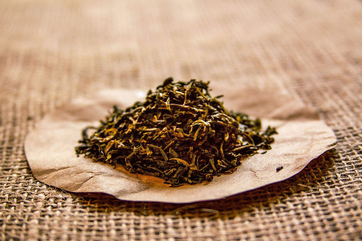 Golden Moon Tea bagless packaging emphasizing pure steeping without plastics