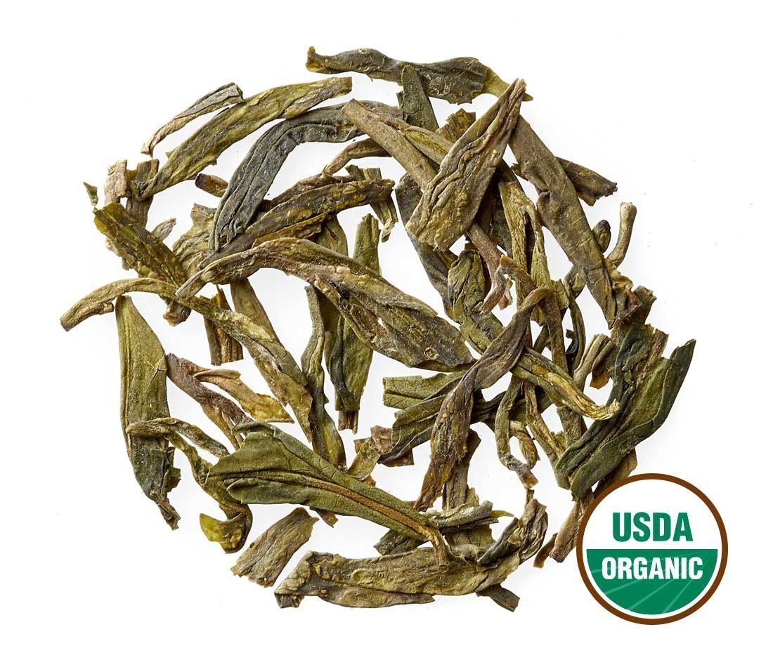 Golden Moon Tea Dragon Well cup steeping shows a clear infusion and garden notes