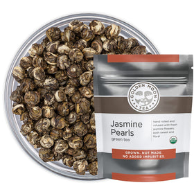 Golden Moon Tea Jasmine Dragon Pearl closeup highlights the delicate pearls for a fragrant brew.