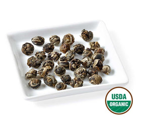 Golden Moon Tea Jasmine Dragon Pearl drying wok reveals craftsmanship behind each pearl, boosting aroma.