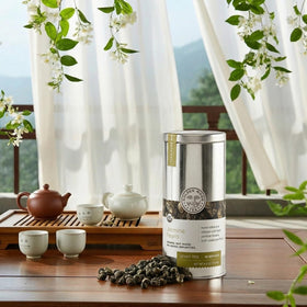 Jasmine petals layered around Pearl by Golden Moon Tea for rich fragrance.
