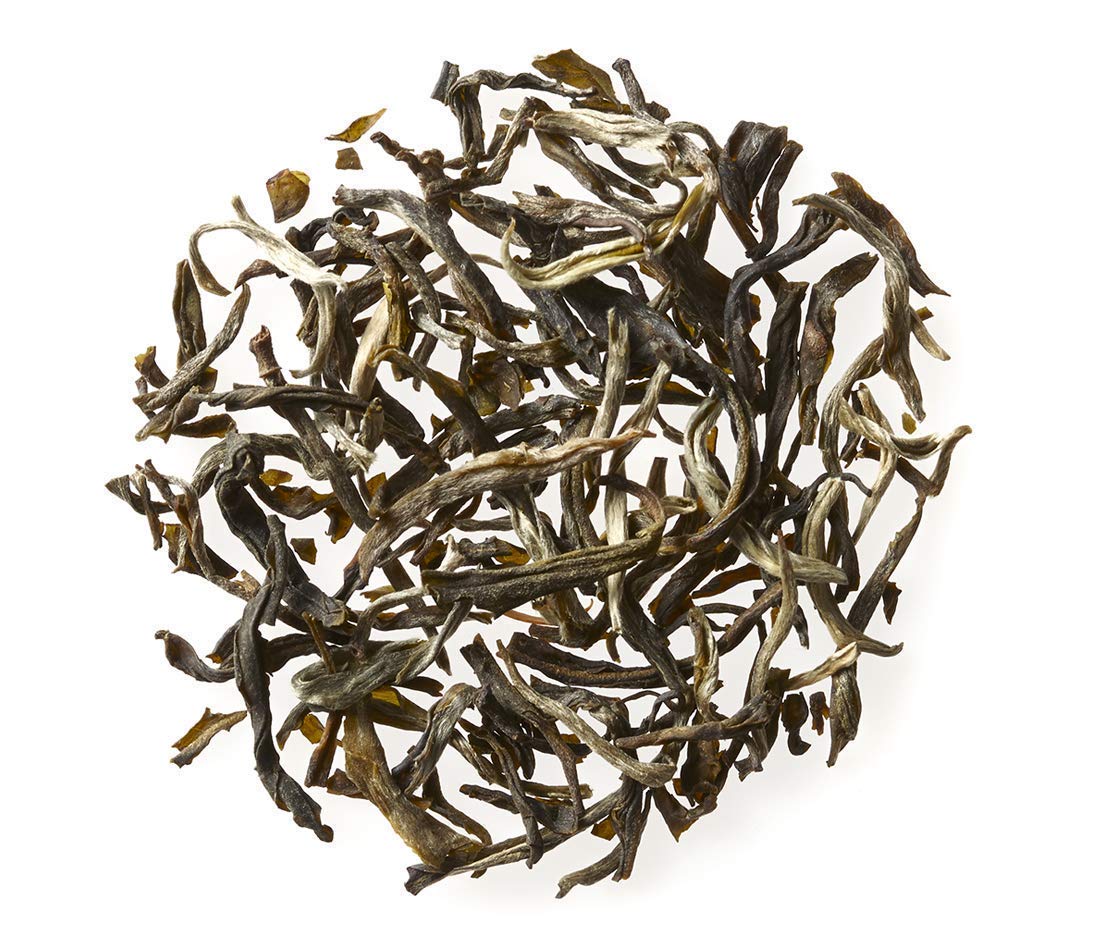 Golden Moon Tea loose leaves in a bowl ready for brewing aromatic jasmine tea