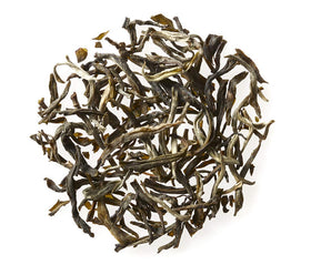 Golden Moon Tea loose leaves in a bowl ready for brewing aromatic jasmine tea