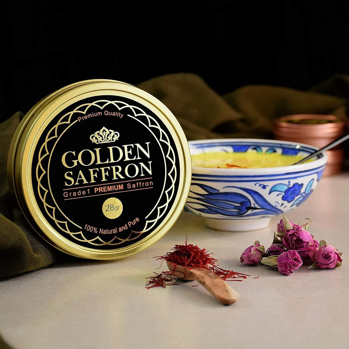 Golden Saffron tea infusion with saffron strands steeping in cup.