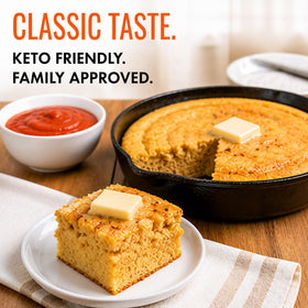 Good Dee's corn bread served with butter on a table setting.