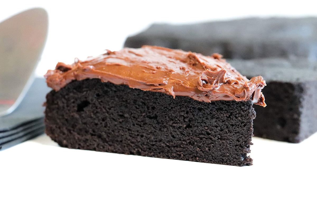 Good Dee's Devil's Food Cake slice served beside coffee for a comforting treat.