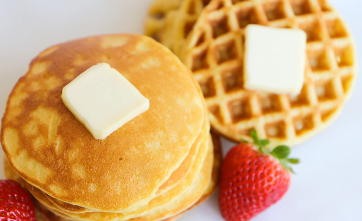 Stack of fluffy pancakes made with Good Dee’s Pancake Mix.