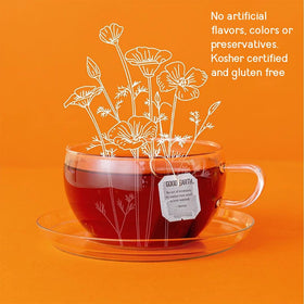 Good Earth Tea Co. Tea bag steeping in cup shows herbal infusion