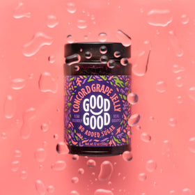Good Good Healthy Jam Variety Pack Concord jar on pantry shelf, rich flavor with fewer calories.