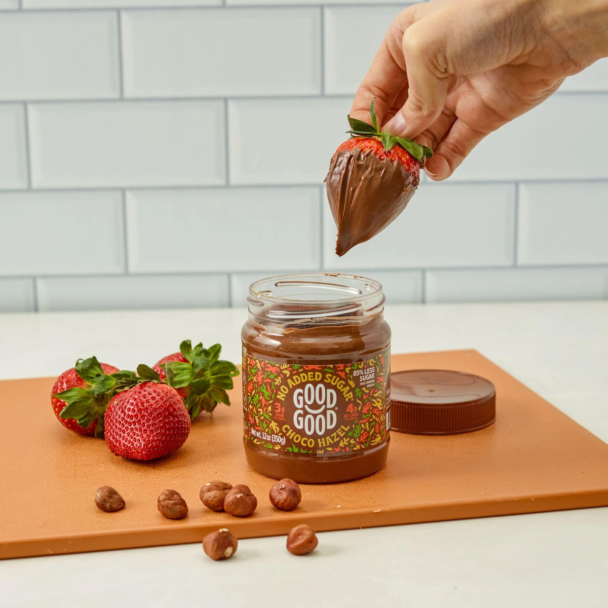 Close-up of Good Good ingredients, roasted hazelnuts and cocoa.