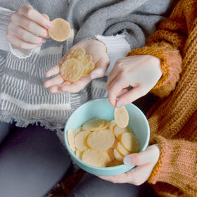 Good Thins crackers with colorfully arranged dips for party grazing.