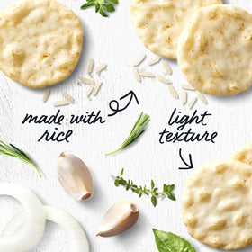 Good Thins crackers served on a charcuterie board with meats and fruit