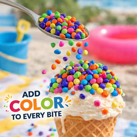 Goodland Farms rainbow candy coated chips decorating cupcakes for festive appeal.