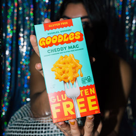 Close-up of Goodles Cheddy Mac ingredients emphasizing non-GMO and clean label