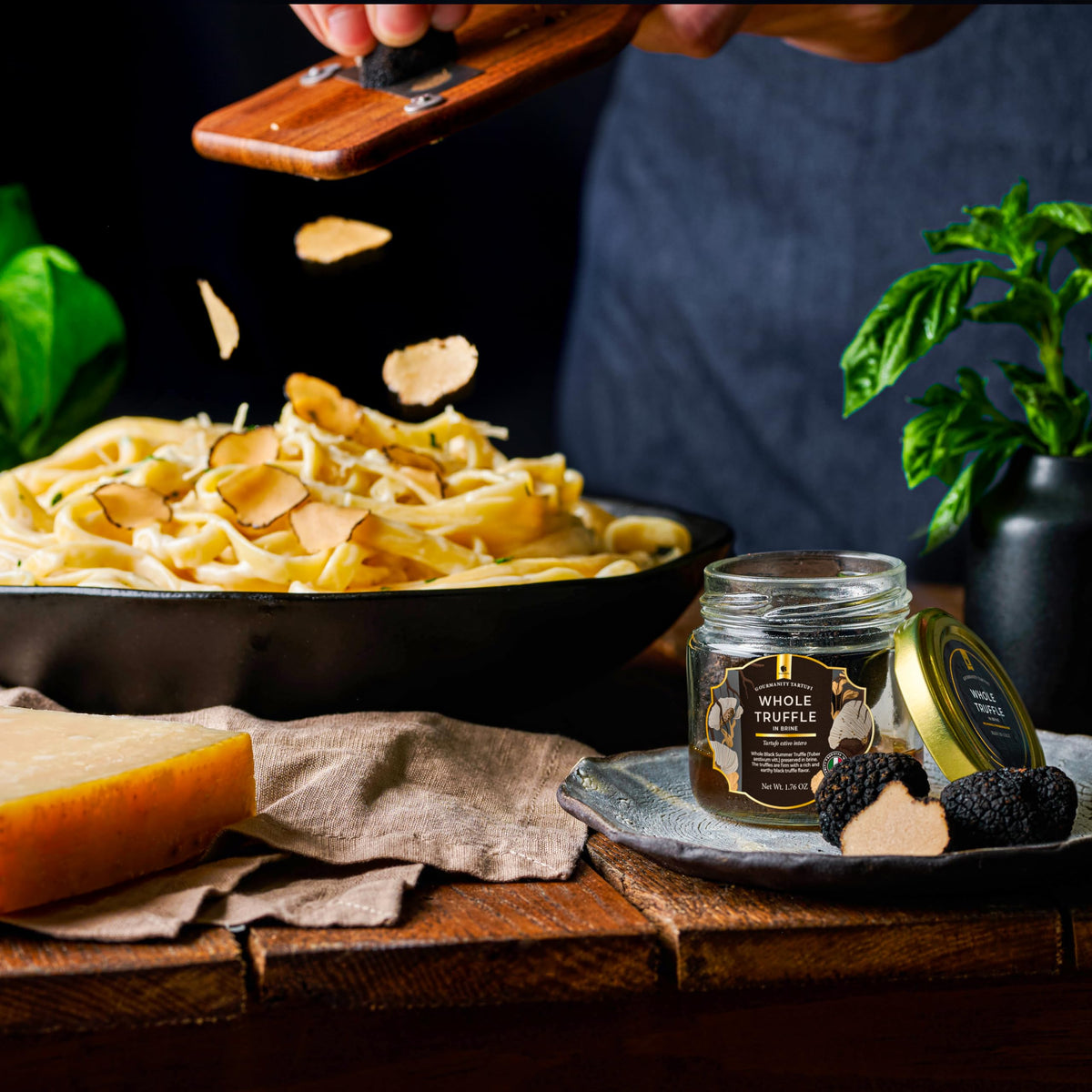 Gourmanity black truffle slices on pasta; luxurious depth of flavor