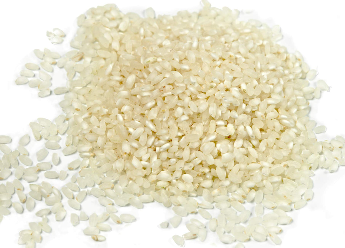 Plate of paella featuring Gourmanity Bomba Rice with fluffy, non-sticky texture.
