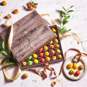 Gourmanity strawberry marzipan piece with smooth almond center, perfect for tea time.