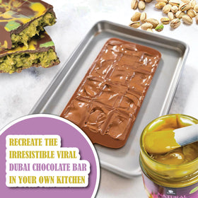 Close-up of smooth Gourmanity pistachio butter, ideal for baking.