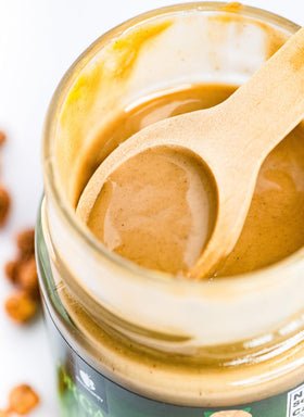 Gourmanity Tigernut Butter with scoop exemplifying dairy-free indulgence.