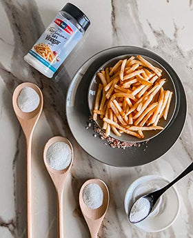 Gourmet Fries Seasonings sprinkled on fries for a savory aroma and crunch