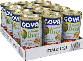 Goya stuffed olives with anchovy filling beside a cocktail spread.