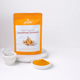 Go-Yogik Lakadong turmeric powder jar highlights sun-dried processing and Himalayan origin.