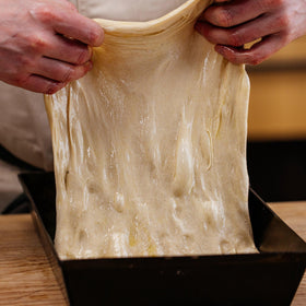 Gozney Detroit dough assembly, showing thick crust potential and portioning.