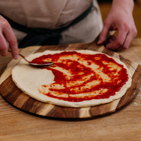 Gozney raw dough portions ready to shape for homemade pizzas.