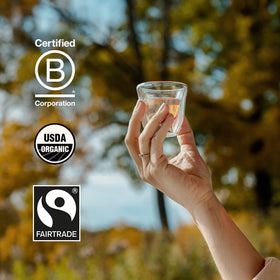 Grace Farms REST Wellness cup pouring scene conveys a comforting bedtime ritual.