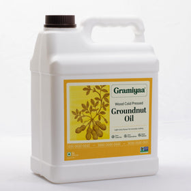 Gramiyaa peanut oil pouring, smooth flow for pan cooking.