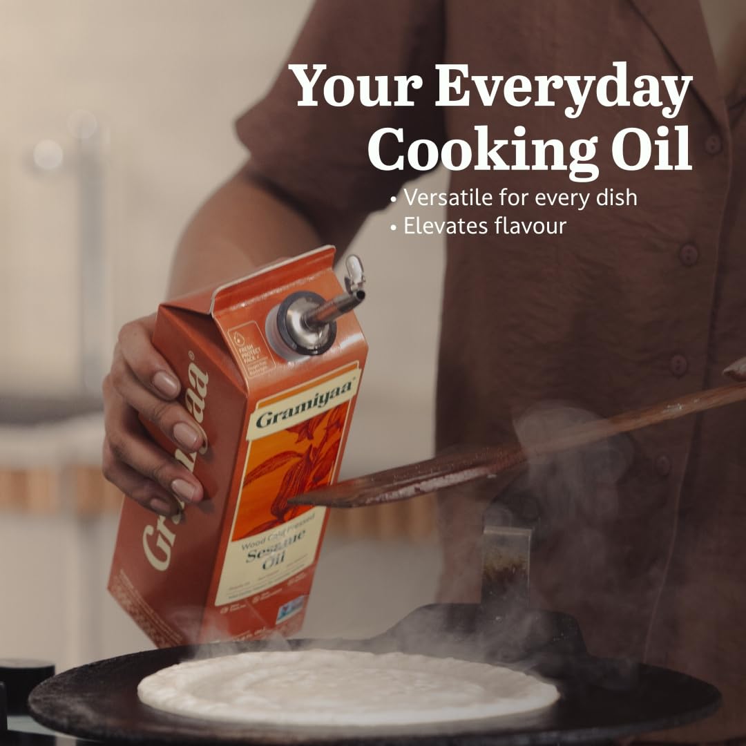 Gramiyaa sesame oil being poured for quick stir-fries