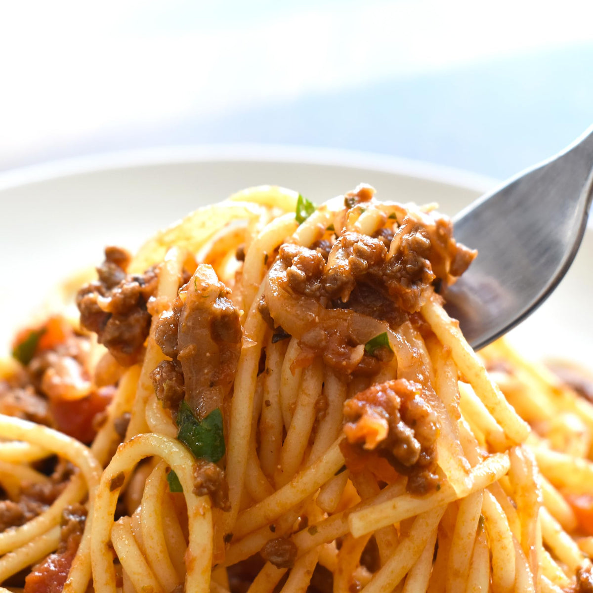 GranAroma Oregano Flakes on tomato sauce for depth of flavor.