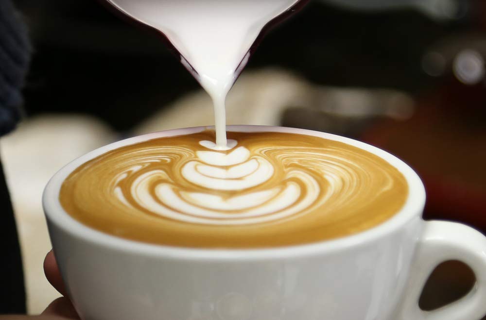 Rich crema forms on top when using Grande Italia Espresso Ground in espresso machines.